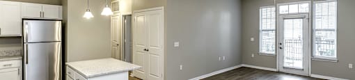 Large Living Room with sophisticated light fixtures  at Legacy Commons, Omaha, Nebraska