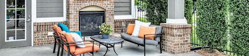 Poolside fireplace and seating area at Legacy Commons Apartments in Omaha, NE