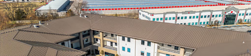 Modern clubhouse featuring community lounge, coffee bar, salon and spa, billiards and poker room, and concierge package room at Parkside Apartments and Shops in Bentonville, AR