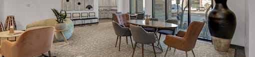 Modern clubhouse featuring community lounge, coffee bar, salon and spa, billiards and poker room, and concierge package room at Parkside Apartments and Shops in Bentonville, AR