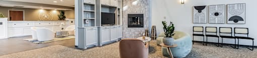 Modern clubhouse featuring community lounge, coffee bar, salon and spa, billiards and poker room, and concierge package room at Parkside Apartments and Shops in Bentonville, AR