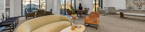Modern clubhouse featuring community lounge, coffee bar, salon and spa, billiards and poker room, and concierge package room at Parkside Apartments and Shops in Bentonville, AR