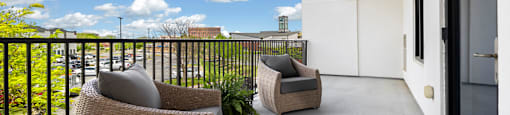 Upscale studio, one, and two-bedroom apartment homes featuring two-tone kitchen cabinetry, quartz countertops, stainless steel appliances, luxury vinyl wood flooring, and much more at Parkside Apartments and Shops in Bentonville, AR