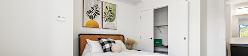 Upscale studio, one, and two-bedroom apartment homes featuring two-tone kitchen cabinetry, quartz countertops, stainless steel appliances, luxury vinyl wood flooring, and much more at Parkside Apartments and Shops in Bentonville, AR