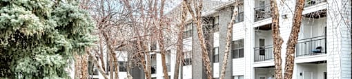 Exterior with trees at Parkwood Terrace in Omaha, NE