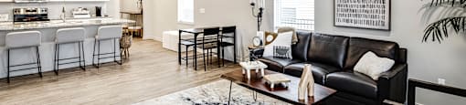 a living room with a couch and a table at Sandstone Villas Apartments, Nebraska, 68116