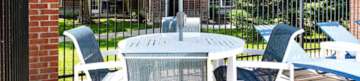 Sparkling Pool side seating at The Landings Apartments, Bellevue, NE