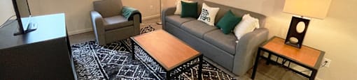 a living room with couches and a table