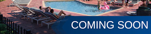 A pool area with people relaxing and a gazebo in the background.