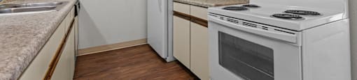 a kitchen with a stove and a refrigerator