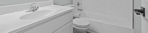 a bathroom with a sink toilet and a shower