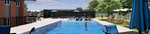 A pool with people swimming and sunbathing.