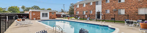 our apartments offer a swimming pool with chairs and tables