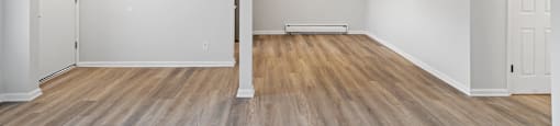 A room with wooden floors and white walls.