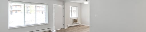 A room with a window and a door.