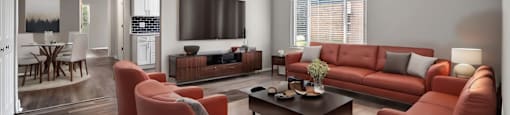 A living room with a red couch and a television.