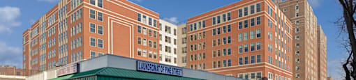A large building with a green awning in front of it.