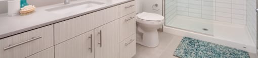 a bathroom with a sink toilet and a shower