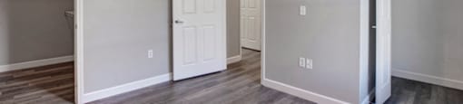 a bedroom with a ceiling fan and a closet