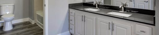 a bathroom with a toilet a sink and a mirror