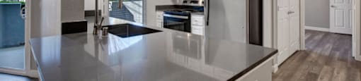 a kitchen with a counter top and a refrigerator