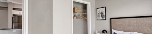 a bedroom with a bed and a closet
