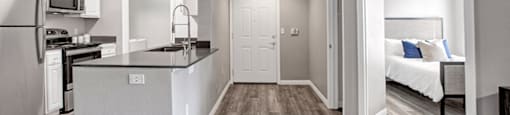 a kitchen and bedroom in a 555 waverly unit