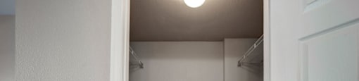 a walk in closet in a 555 waverly unit