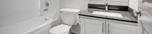 a bathroom with a toilet sink and bathtub