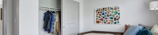a bedroom with a bed and a closet