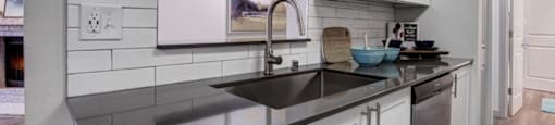 a kitchen with a sink and a dishwasher