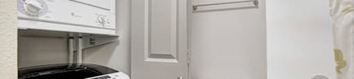 a bathroom with a washer and dryer and a toilet