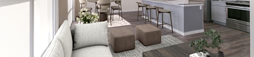 A modern kitchen and living room with a grey sofa and wooden coffee table.