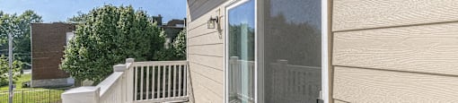 the view from the deck of a home with a large window
