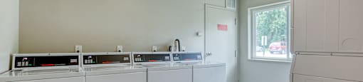 On site laundry facilities with 4 washers and 4 dryers