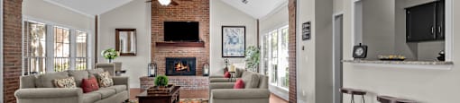 A living room with a fireplace and a television.