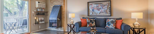 a living room with a couch coffee table and a fireplace