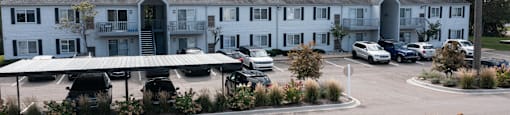 apartment parking lot with covered parking