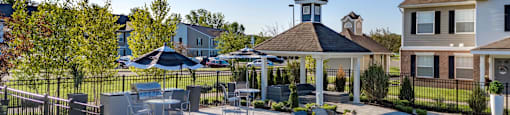 the preserve at ballantyne commons pool and patio area with chairs and a pool