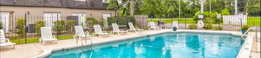 Outdoor sparking swimming pool at Barrington Park with pool furniture.