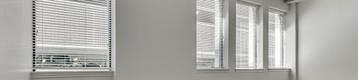 A room with wooden floors and white walls.