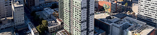 A cityscape with a mix of modern and older buildings.