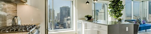 A modern kitchen with a view of the city.