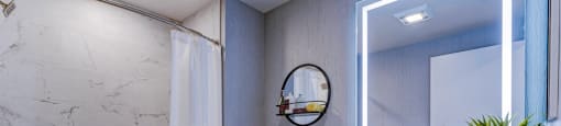 A bathroom with a white tub, toilet, and sink.