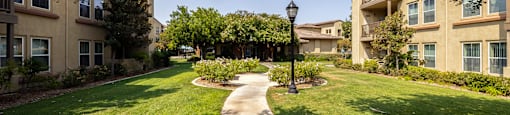 Courtyard and roses at 55+ FountainGlen Stevenson Ranch, California