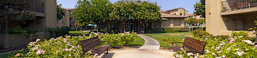 Courtyard benches and roses at 55+ FountainGlen Stevenson Ranch, Stevenson Ranch, CA