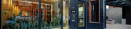 A modern building with glass doors and windows.