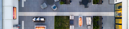 A parking lot with cars and a building with a fireplace.