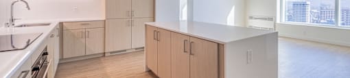 A kitchen with wooden floors and white appliances.