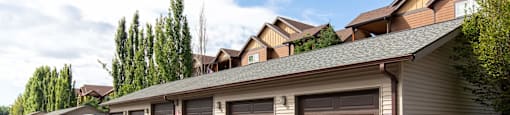 A row of brown garages at Mullan Reserve Apartments in Missoula, MT